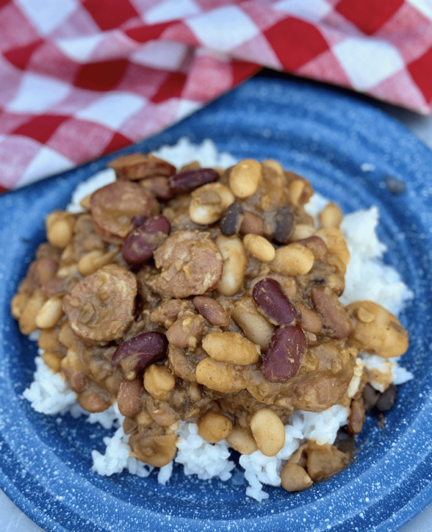 Here's an alt tag for the image: Delicious beans and rice with sausage.